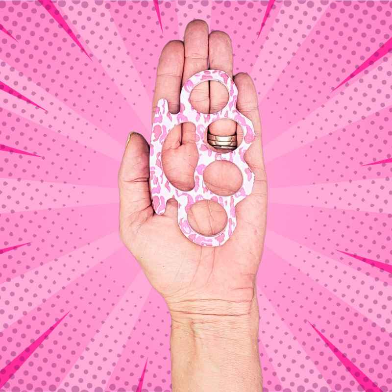 pink_camo_knuckle_ring_in_hand